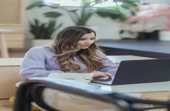  concentrated woman working on laptop for remote project small