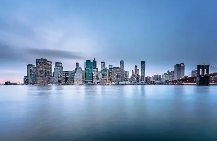  body of water near city buildings small