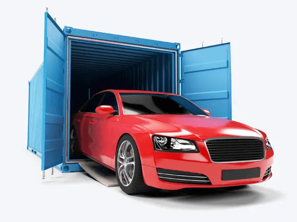 a red car being loaded into a shipping container