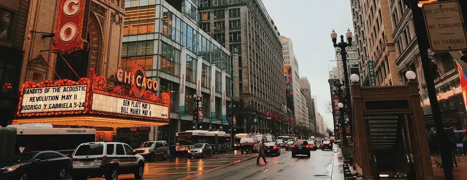 An image of a street in Chicago, featuring the Chicago Theatre in the distance.